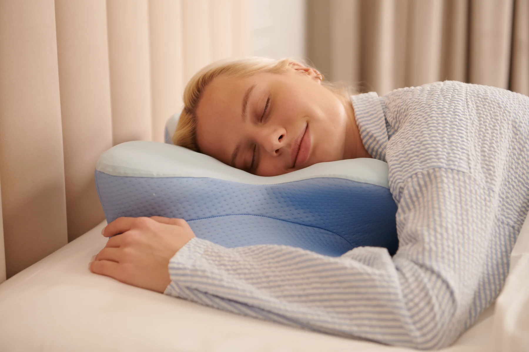 Derila Ergo pillow used in a warm neutral bedroom